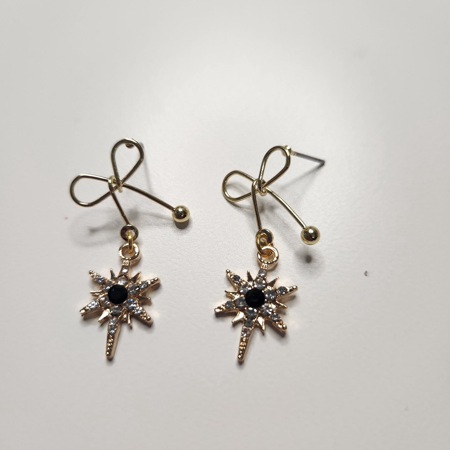 HANDMADE tarnish free gold plated diana bow earrings with black star dangle